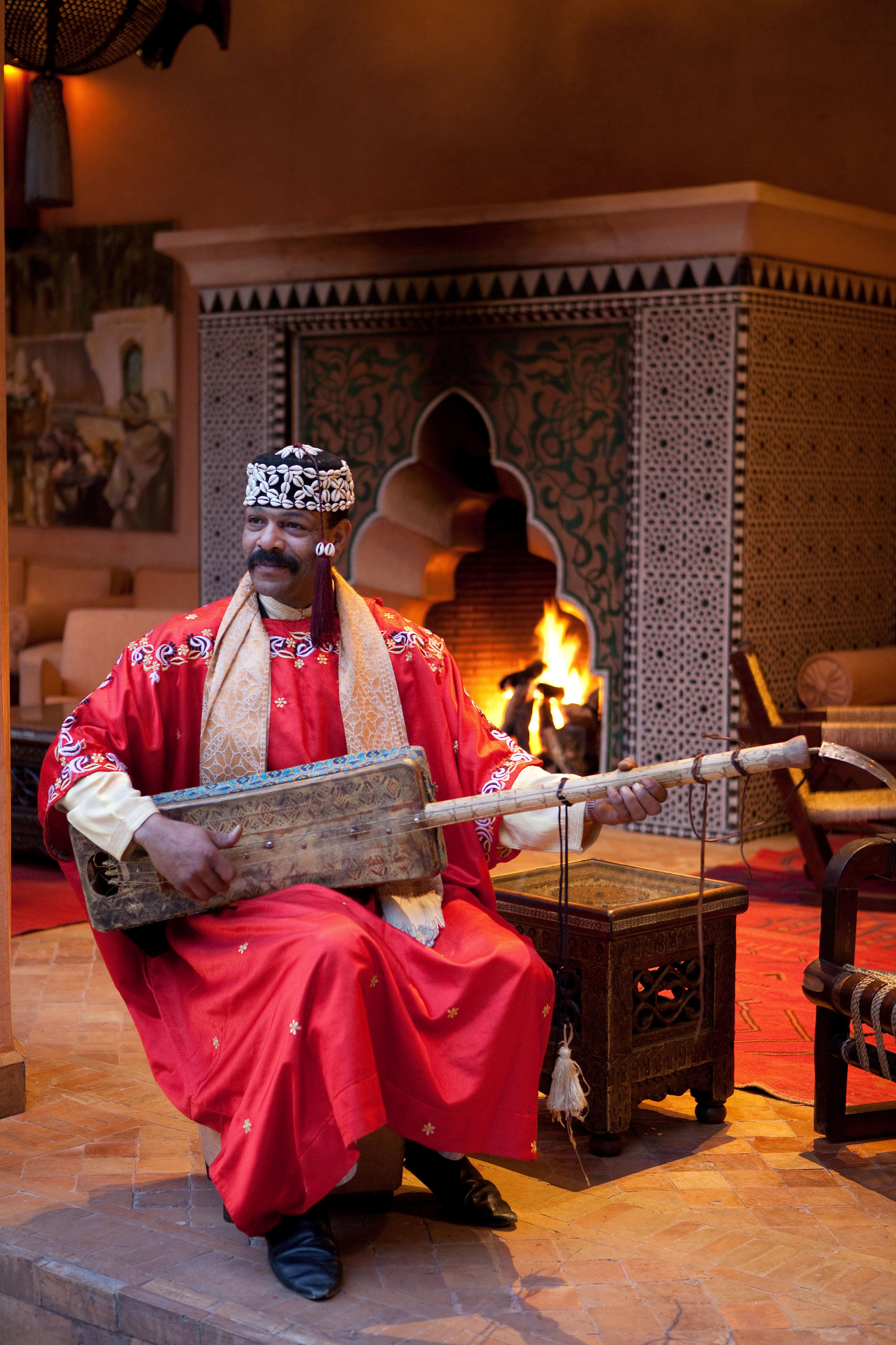 Les Jardins De La Koutoubia Hotel Marrakesh Exterior photo Gnaou musician playing the guembri